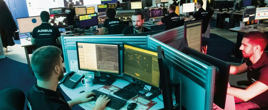Cybersecurity experts coding on their computers 