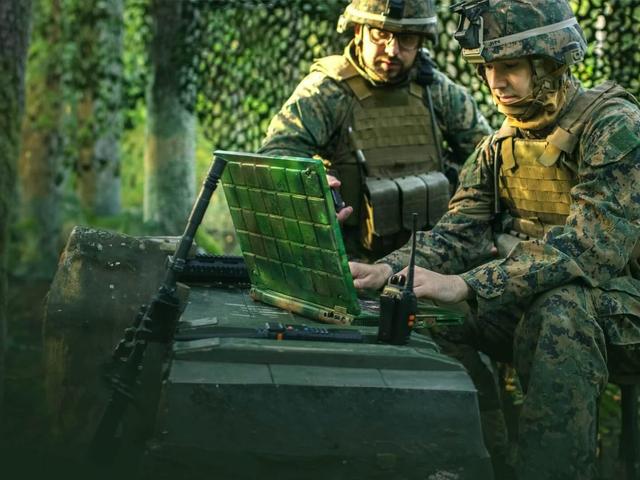 Soldiers on computers in military operations