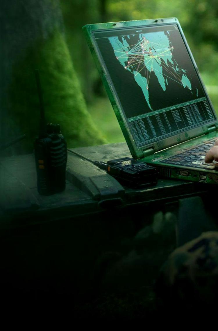 Soldier on computer analysing potential threats