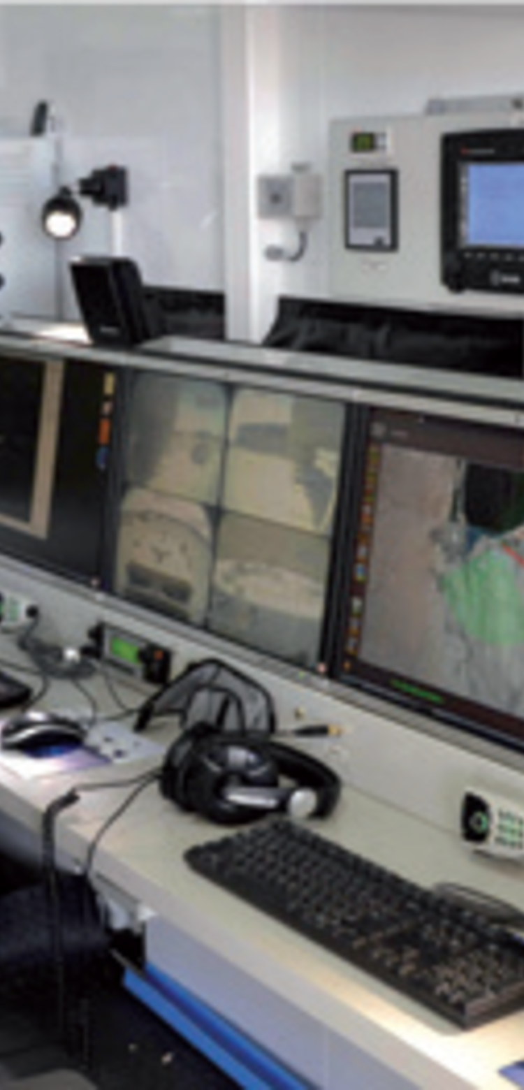 Control room with screening showing video