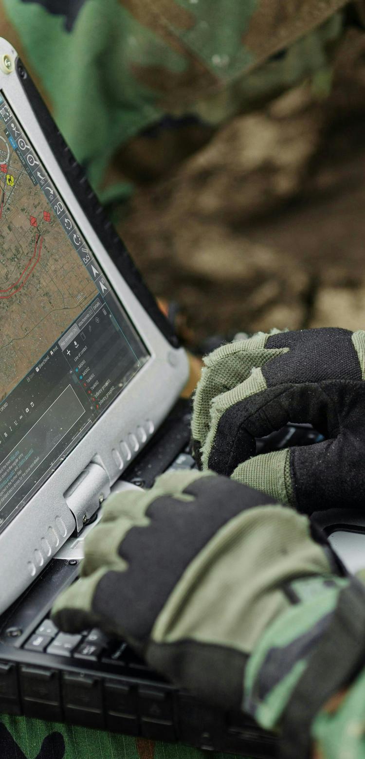 Soldier typing on a computer