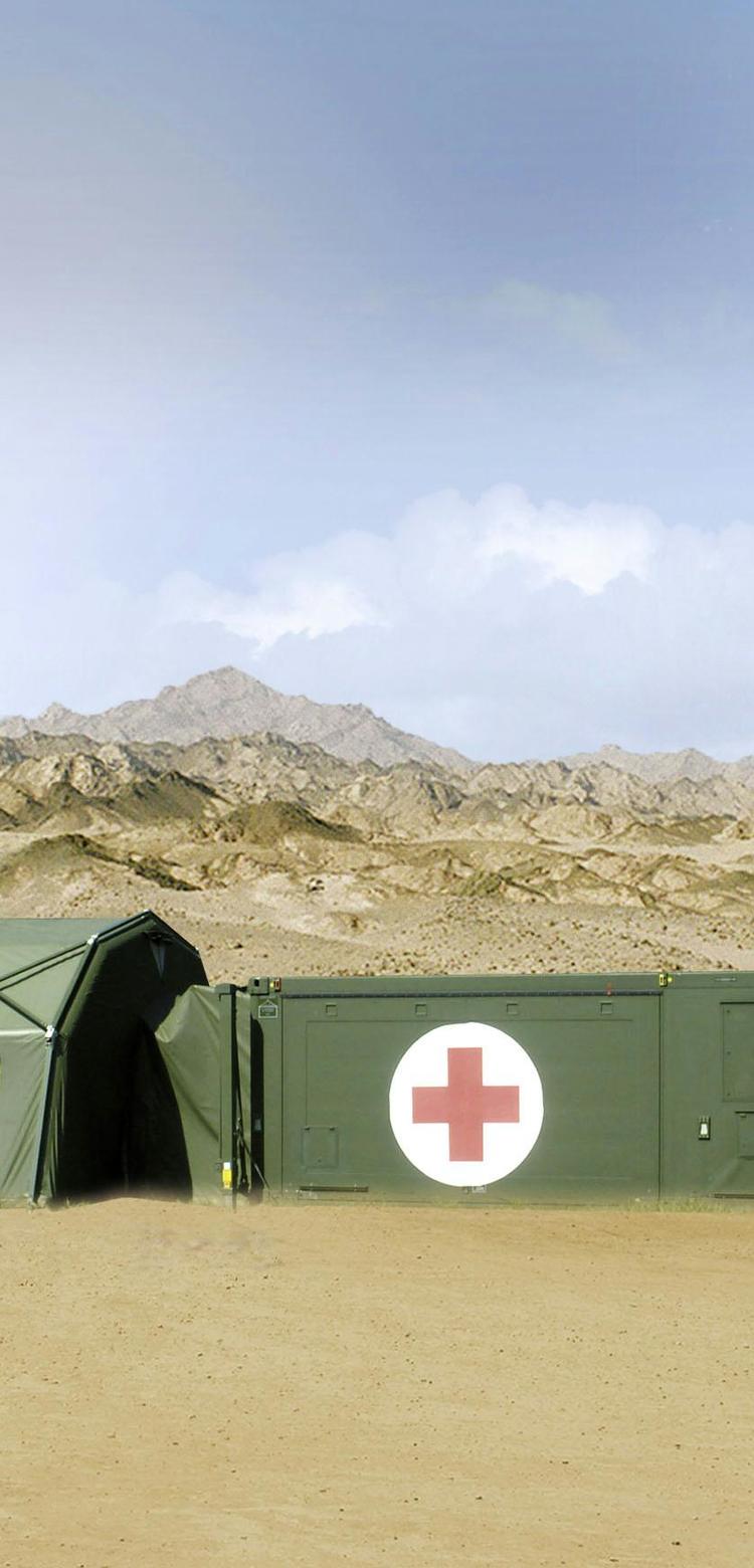 Aerial photograph of a Role Two Rescue Centre in the field, consisting of interconnected tents and containers.